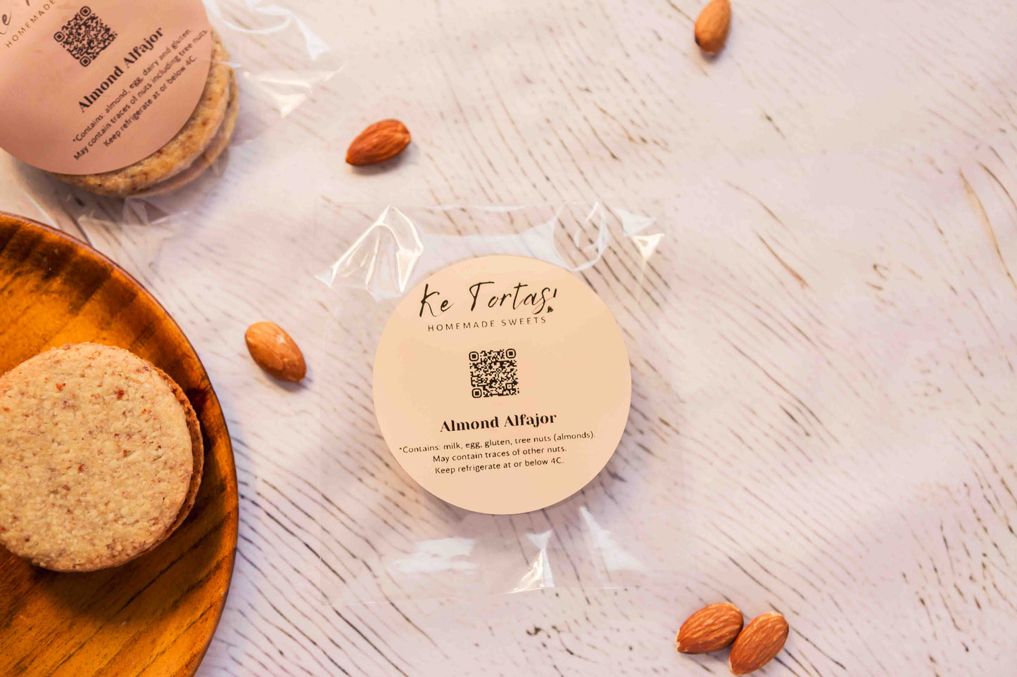 Individually wrapped almond alfajor, handmade and filled with dulce de leche.