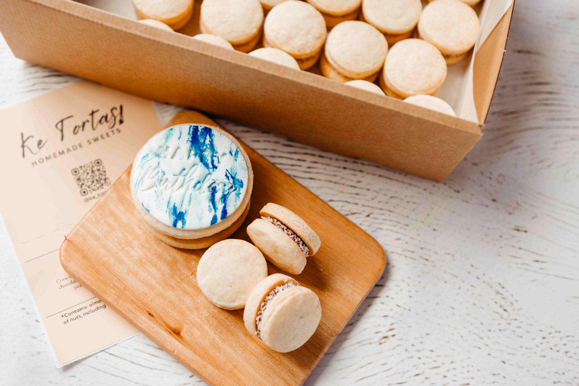 Size detail of a large personalised alfajor with mini alfajores, handmade in Perth.