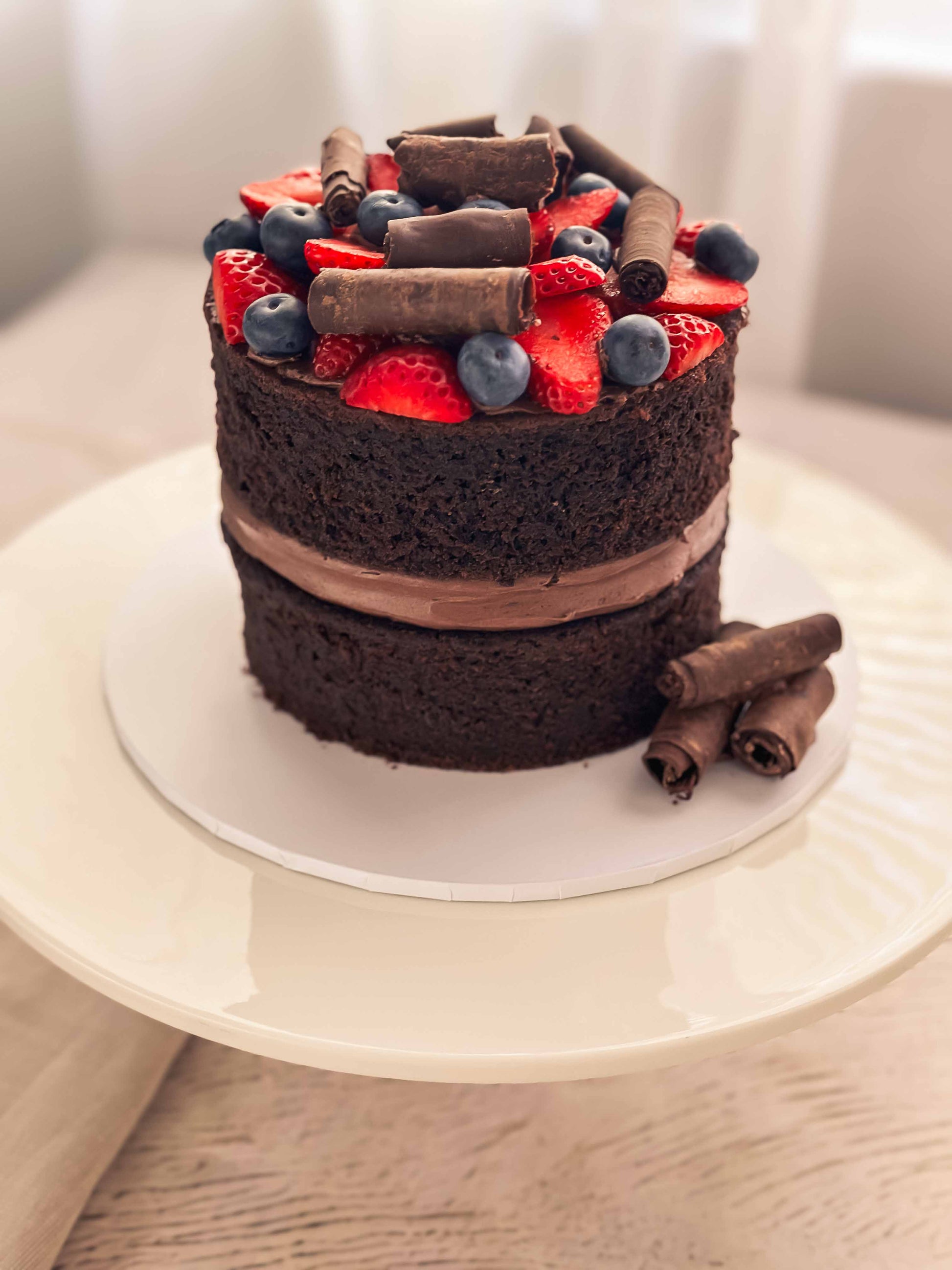 Chocolate cake with berries and chocolate 