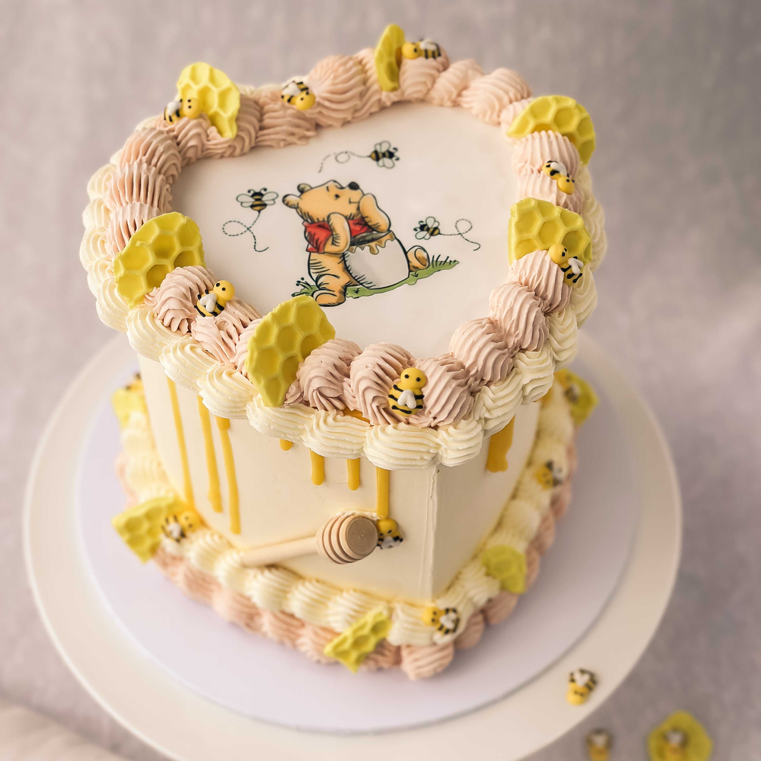 Winnie the pooh heart shape cake with buttercream